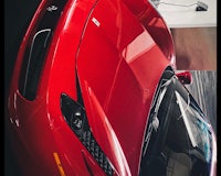 a close up of a red sports car