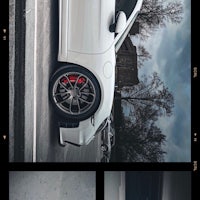 a photo of a white car on a street