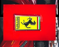 a ferrari badge on a red car